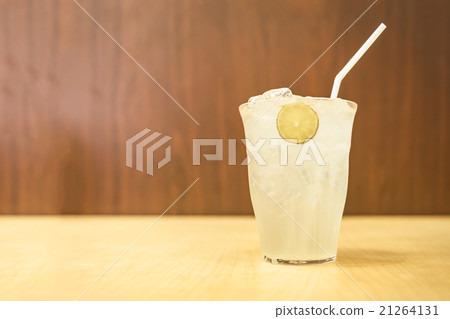glass of iced honey and lemon on wood table glass of iced honey and lemon on wood table 21264131