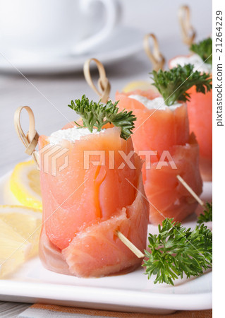 Banquet. Rolls of red fish with cream cheese 21264229