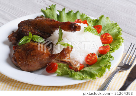 roasted duck leg with rice closeup horizontal. 21264398