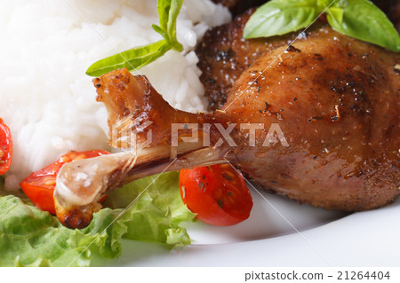 roasted duck leg with rice and basil on lettuce roasted duck leg with rice and basil on lettuce 21264404