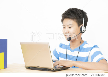 Boys who speak English on their computer PC middle school students primary school videophone English conversation chat 21266385