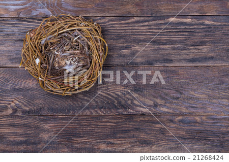 Empty birds nest on wooden background 21268424