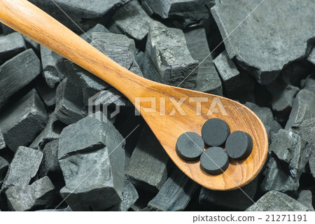 activated carbon pill in wood spoon activated carbon pill in wood spoon 21271191