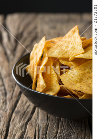 Bowl of tortilla Chips on rustic background. 21272501