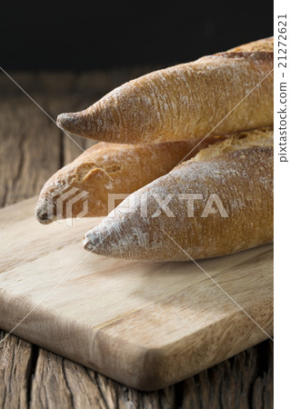 Bread loaves on an old rustic wooden table. 21272621