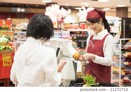 A woman shopping at supermarket cashier 21272718