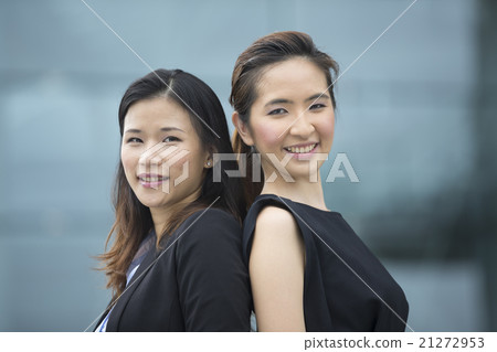 Portrait of Indian business man and woman in a modern urban sett Portrait of Indian business man and woman in a modern urban sett 21272953