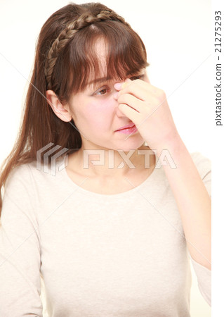 A woman suffering from tired eyes A woman suffering from tired eyes 21275293