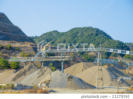 A gravel collection site that produces gravel of construction materials 21278591