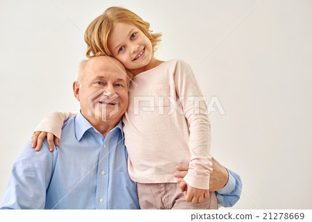 Little granddaughter hugging her grandfather 21278669