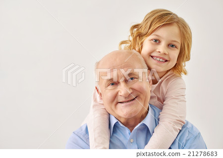 Little granddaughter hugging her grandfather 21278683
