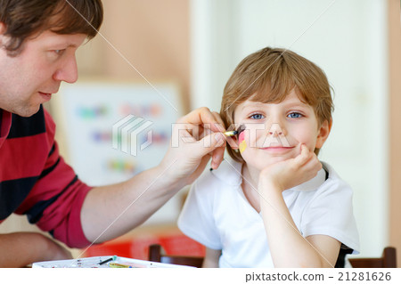 Dad painting flag on face of little kid for Dad painting flag on face of little kid for 21281626