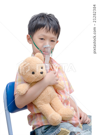 Little boy using oxygen mask on white background Little boy using oxygen mask on white background 21282384