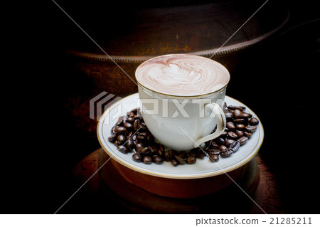 Latte art, coffee in coffee beans and Asian potter 21285211