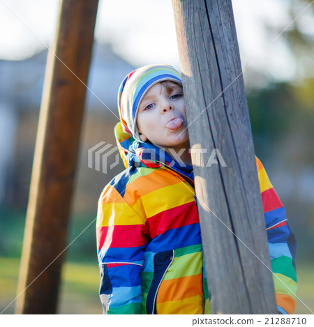 Little kid boy having fun outdoors Little kid boy having fun outdoors 21288710