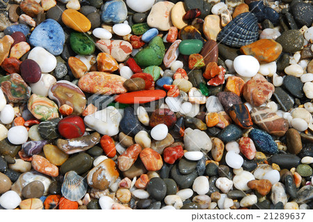 Colorful sea pebbles on the shore Colorful sea pebbles on the shore 21289637