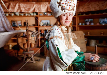 Young woman in traditional yurt dwelling. 21293358