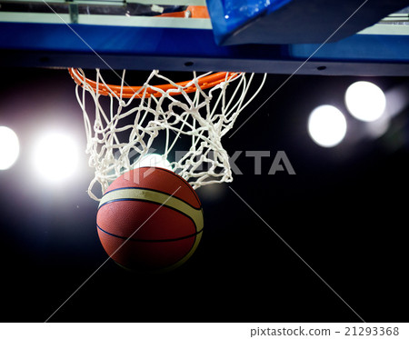 Basketball going through the hoop  21293368