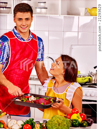 Family cooking meat at kitchen. Family cooking meat at kitchen. 21293629