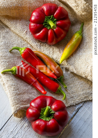 red paprika and pepper on a wooden table red paprika and pepper on a wooden table 21295458