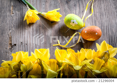 Bunch of daffodils with easter eggs for Easter Bunch of daffodils with easter eggs for Easter 21296004