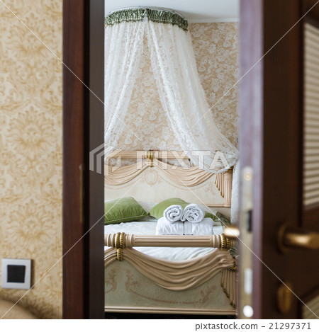 Half open door of a hotel bedroom 21297371