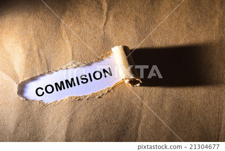 Torn paper with word COMMISION 21304677