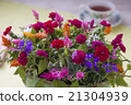 Arrangement of carnation and potatoes 21304939