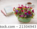 Arrangement of carnation and potatoes 21304943
