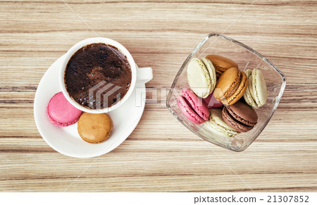 Cup of black coffee with french colorful macarons, view from abo 21307852