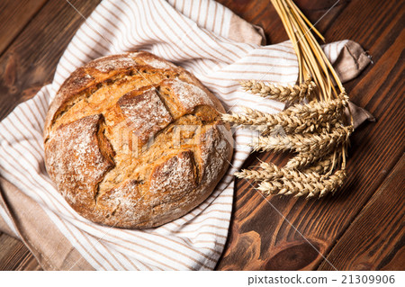 Bread assortment on wooden surface Bread assortment on wooden surface 21309906