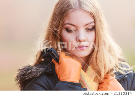 Portrait sad attractive woman outdoor Portrait sad attractive woman outdoor 21310314