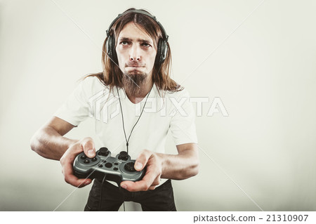 Male player focus on play games Male player focus on play games 21310907