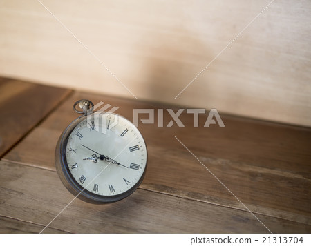 Floating clock on wookd background 21313704