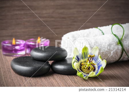 spa concept of passiflora flower, black zen stones spa concept of passiflora flower, black zen stones 21314214