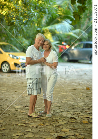 elderly couple rest at tropical resort elderly couple rest at tropical resort 21315071