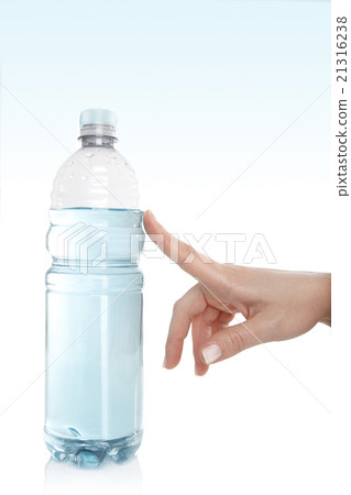 Woman opens a water bottle Woman opens a water bottle 21316238