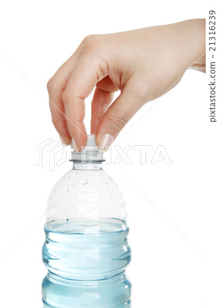 Woman opens a water bottle Woman opens a water bottle 21316239