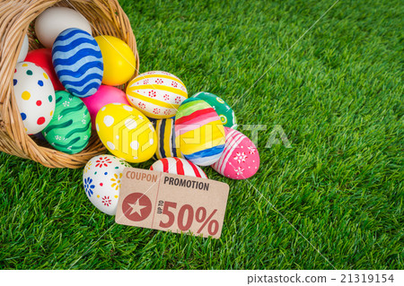 Easter eggs Sale Coupon, voucher, tag on Fresh Green Grass 21319154