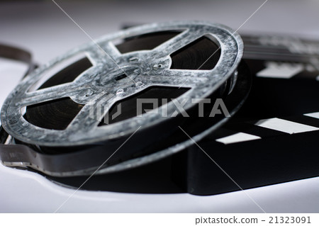 Old rusty roll of film and cinema clap Old rusty roll of film and cinema clap 21323091