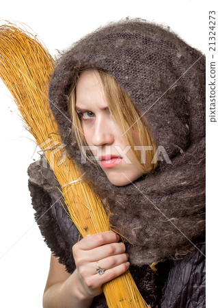Angry woman in a scarf with a broom in his hand 21324273