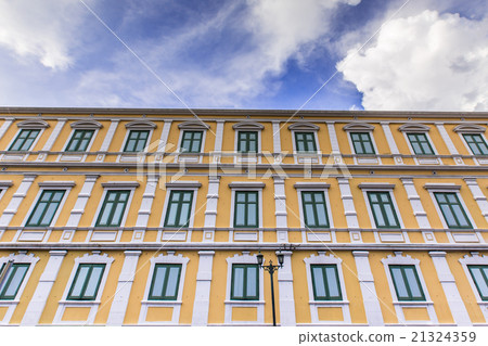 Yellow apartment with green wooden with clear sky 21324359