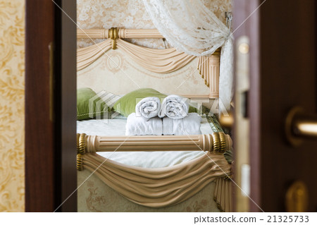 Half open door of a hotel bedroom 21325733