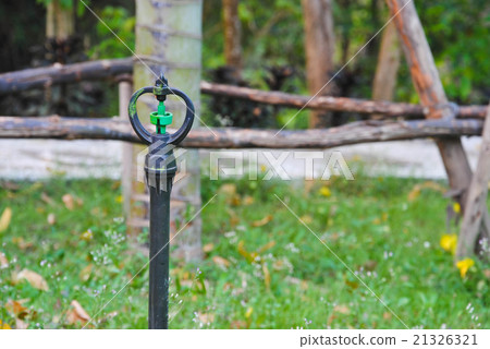 sprinkler watering tool in garden 21326321