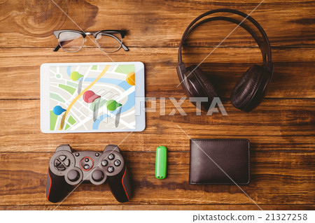 Composite image of multi colored navigation pointers on map 21327258