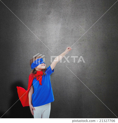 Composite image of masked girl pretending to be superhero 21327706