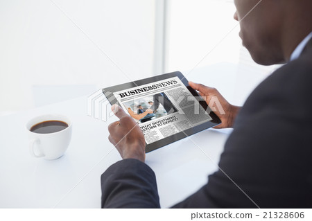 Composite image of businessman using digital tablet 21328606