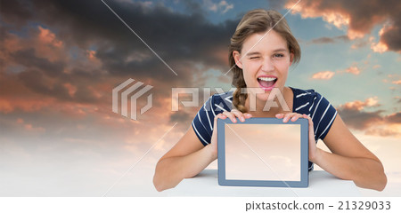 Composite image of woman showing tablet pc 21329033