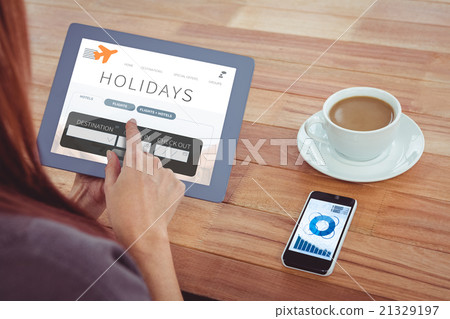 Composite image of over shoulder view of hipster woman using tab 21329197