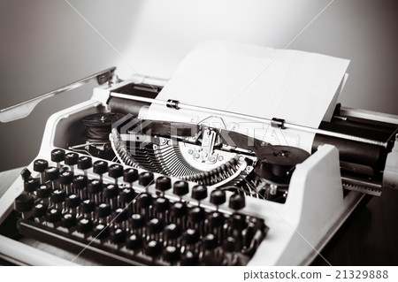 Old typewriter on wooden table. Vintage style Old typewriter on wooden table. Vintage style 21329888